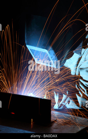 Welder working in manufacturing plan Stock Photo