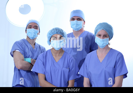 Group of surgeons in scrubs Stock Photo