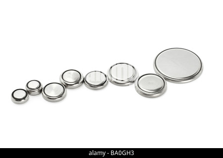 Button shape lithium batteries of various sizes on white background Stock Photo