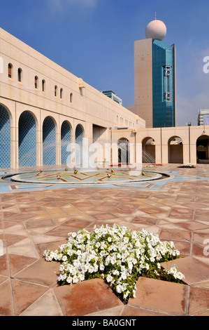 Abu Dhabi Cultural Foundation paved courtyard and fountain with petunia flowers United Arab Emirates Middle East Asia Stock Photo