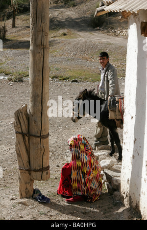 Tajik man and woman wearing traditional dress, Marguzor Lakes, Fan Mountain, Tajikistan, Central Asia Stock Photo