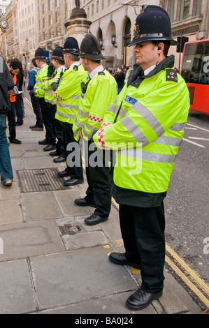 A row of policemen standing at G20 Summit protests, London, England, UK Stock Photo