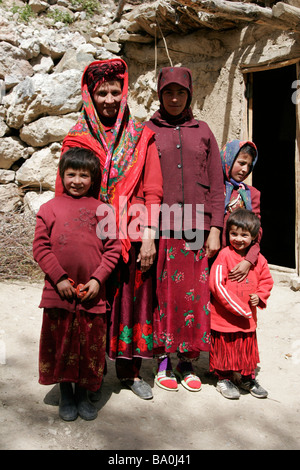 Tajik family wearing traditional dress and hat, Marguzor village, Marguzor Lakes, Fan Mountain, Tajikistan, Central Asia Stock Photo