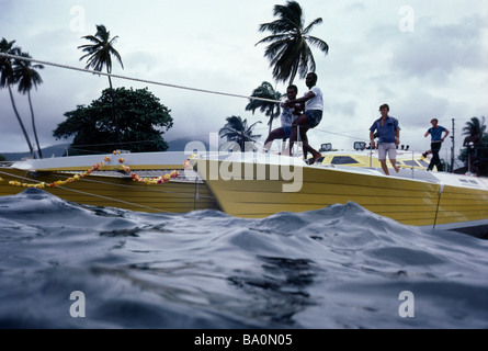 Launching by man power a 76 catamaran Spirit of St Christopher in St Kitts West Indies Stock Photo