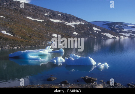 Melting ice floe in blue Mountain lake Lapland Sweden Stock Photo