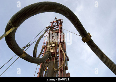 Tower and discharge hose for air rotary drilling rig with casing hammer This equipment is commonly used to drill water wells Stock Photo