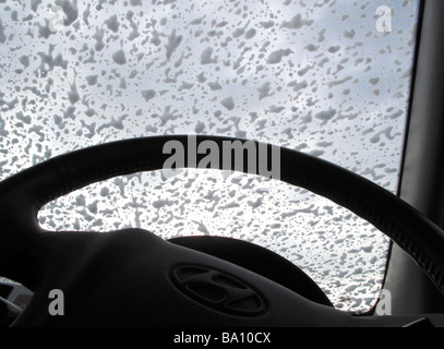 Soap suds on window of car being washed Stock Photo