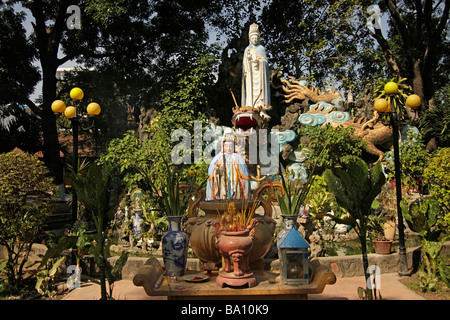 Dragons and Deities statues in the garden of Giac Lam Pagoda in Saigon Ho Chi Minh City Vietnam Stock Photo