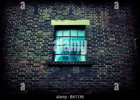 Window with a bullet hole in Manchester UK Stock Photo