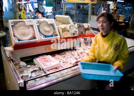 Lady selling fugu (puffer fish) at a market in Shimonoseki, Japan. Fugu is the fish that, if prepared incorrectly, can be poisonous. Stock Photo