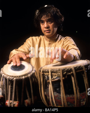 Indian musician Zakir Hussain, playing tabla, in London. Stock Photo