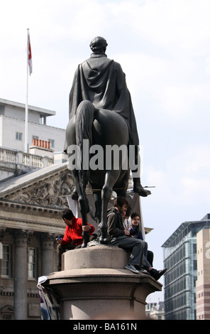 Protestors on the Duke of Wellington statue outside Bank of England at the G20 protests in London Stock Photo