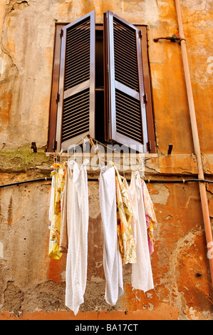 Washing hanging from window in Trastevere Rome Stock Photo