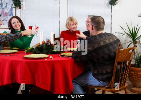Toast being made to older couple Stock Photo