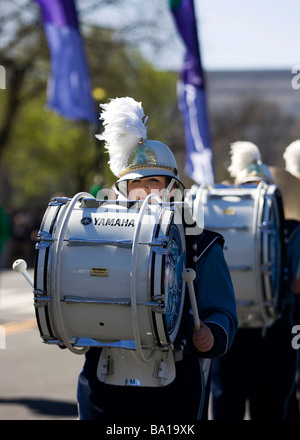 Young Caucasian female drummer in high school marching band Stock Photo