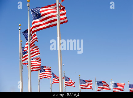 American flags at the Washington Monument form arc Stock Photo