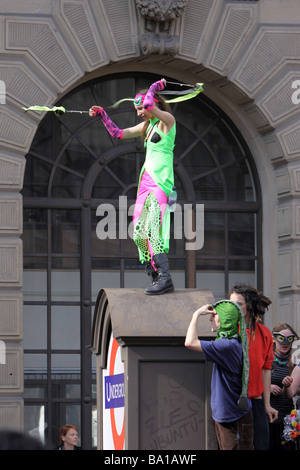 A protestor dancing at the G20 protests in London Stock Photo