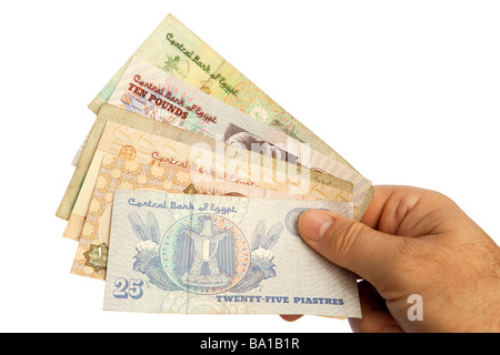 Money male hands holding handful of Egyptian currency Stock Photo