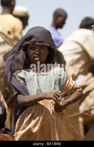 Bedouin children gather at a well in the Sudanese desert as generations have done before them Stock Photo