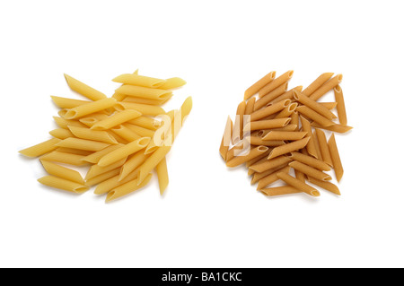 Dried penne pasta wholemeal and plain Stock Photo