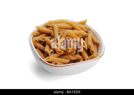 Dried wholemeal penne pasta Stock Photo