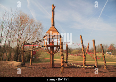 A children's wooden and rope climbing frame in the children's play area of the Bedfont Lakes Country Park, Middx, UK. Stock Photo