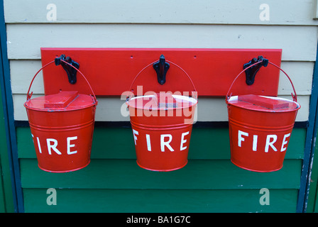 Three old fire buckets Stock Photo