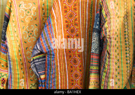 A close up of ethnic tribal jackets in the night market of Luang Prabang Laos