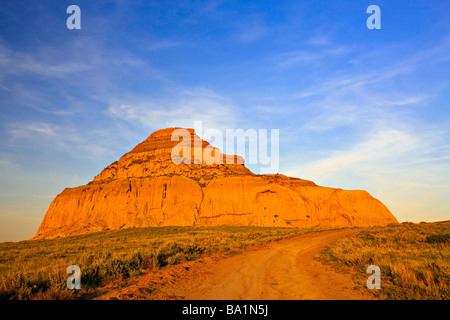 Road leading to Castle Butte during sunset in the Big Muddy Badlands Southern Saskatchewan Canada Stock Photo