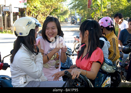 Vietnamese teenagers socialize after school in Hoi An Vietnam Stock Photo