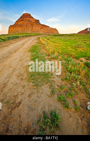 Road leading to Castle Butte during sunset in the Big Muddy Badlands Southern Saskatchewan Canada Stock Photo