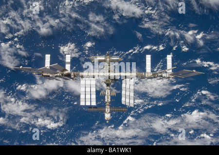 March 25, 2009 - The International Space Station, backdropped by a blue and white Earth. Stock Photo