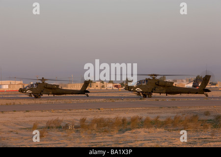 Tikrit, Iraq - A pair of AH-64 Apache helicopters prepare for takeoff. Stock Photo