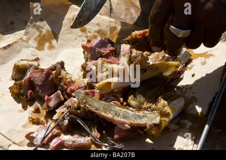 Senegalese Man Selling Roast Mutton in Senegal West Africa Stock Photo