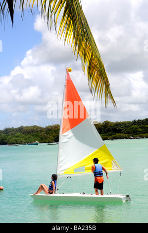 Blue Bay Mauritius island tourists on yacht at Private beach of Shandrani hotel near Mahebourg Stock Photo