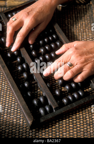 A wooden abacus or counting frame traditionally used in Asia Stock Photo