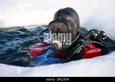 Ice diving or plongee sous glace in the frozen Tignes lake, in the ski resort of Tignes Le Lac, France Stock Photo