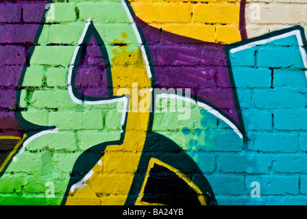 Graffiti closeup on the textured brick wall Stock Photo