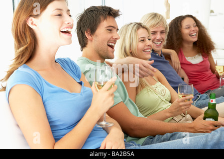 Friends Watching Television Together Stock Photo