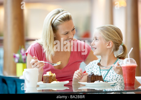 Mother And Daughter Having Lunch Together At The Mall Stock Photo