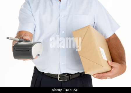 Courier Holding A Parcel And An Electronic Clipboard Stock Photo