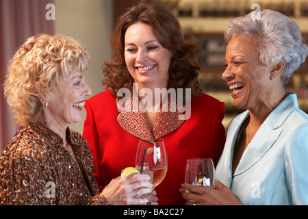 Friends Socializing At A Bar Stock Photo