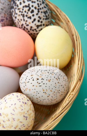 Colorful Eggs In A Basket Stock Photo