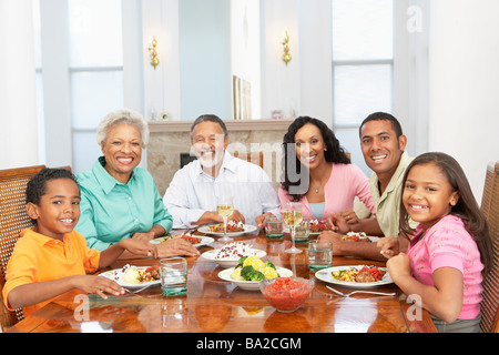 Family Having A Meal Together At Home Stock Photo