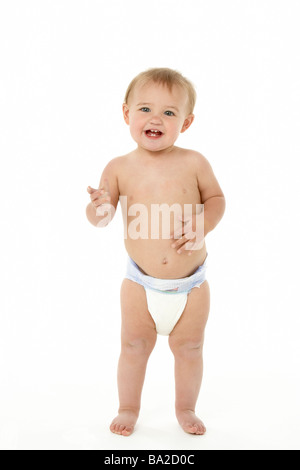 Portrait of cute baby girl standing in bed Stock Photo - Alamy