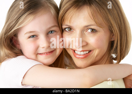 Mother And Daughter Smiling And Hugging Stock Photo