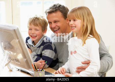 Father And Children Using Computer Stock Photo
