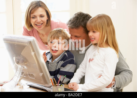 Family Group Using Computer Stock Photo
