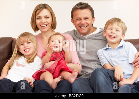 Family Group On Sofa Stock Photo