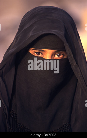 Portrait of Yemeni Muslim Woman Wearing Islamic Dress, Black Veil, Hijab or Black Niqab, Showing Brown Eyes, Marib, Yemen Stock Photo